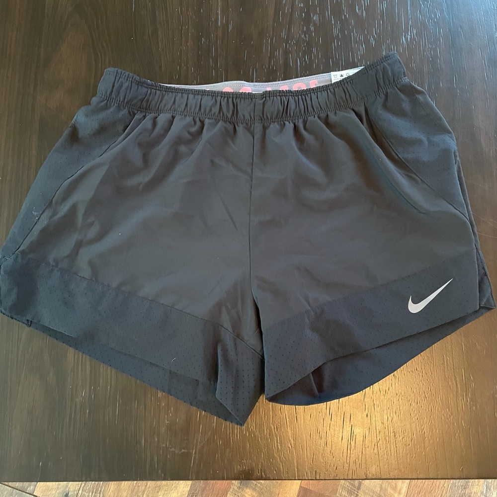 Nike athletic shorts w/ built in spandex - medium